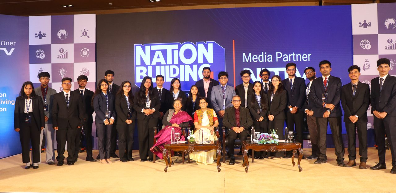 Young people and speakers on stage at a Building India event