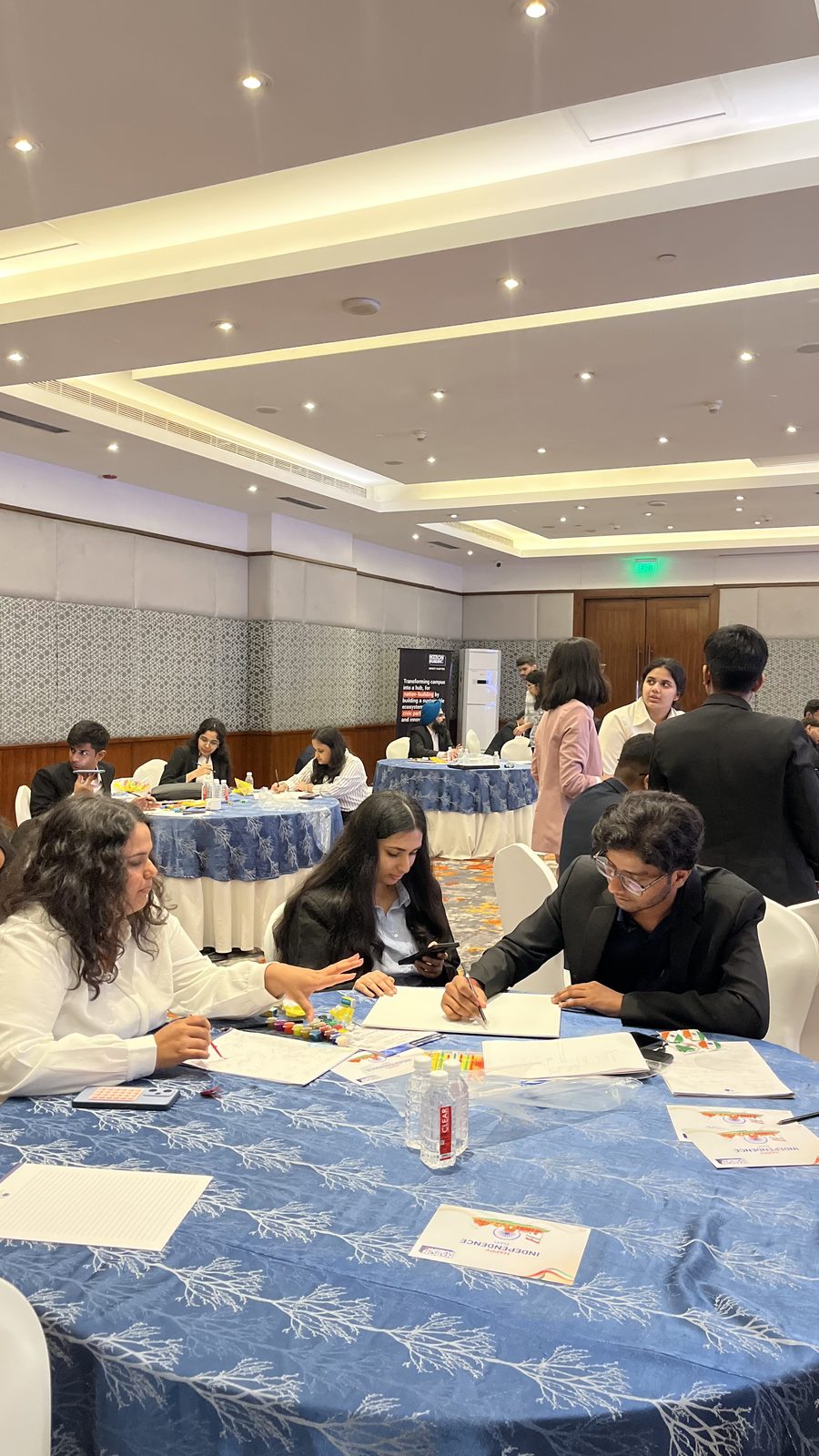 Impact Chapter teams at work around the tables