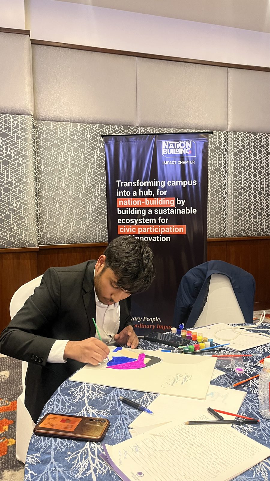 A member working on the chapter vision board